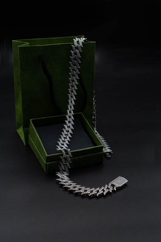 Oversized leaf-shaped with pointed edges featuring a hip-hop Cuban chain design fully encrusted with diamonds 24 INCH ONLY